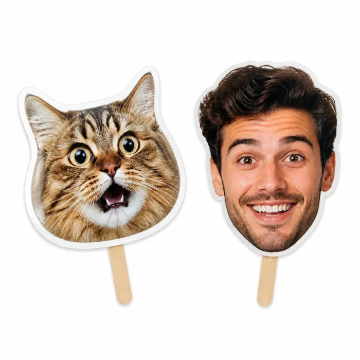 Cat and young man big head cutouts on short sticks